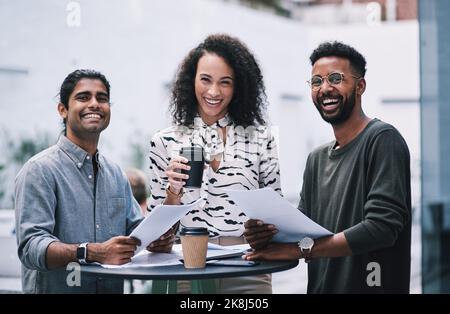 The best conference to collect new business contacts. a group of young businesspeople having a meeting at a conference. Stock Photo