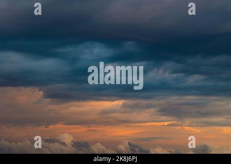 Dramatic clouds. Cloudscape at sunrise. Cinematic clouds background photo. Heaven or spiritual concept background. Stock Photo