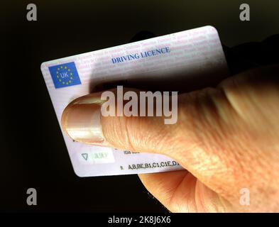 File photo dated 29/09/14 of the plastic identity card of a UK driving licence. More than 900,000 drivers risk a £1,000 fine after failing to renew photocard licences which expired in the past year, an investigation has found. Issue date: Monday October 24, 2022. Stock Photo