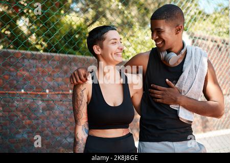 young sporty people talking in gym, after training, mixed race