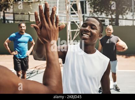 Teamwork, high five or basketball in zoom for support, motivation or game on basketball court. Happy, team health or diversity for sport, games Stock Photo