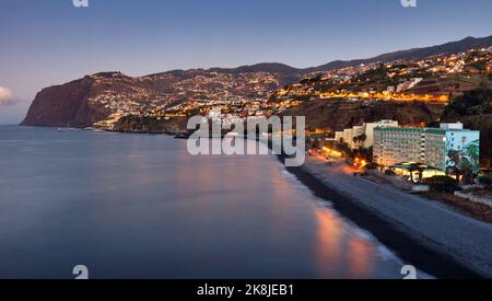 Funchal city at night near Praia Formosa beach, Madeira - Portugal Stock Photo