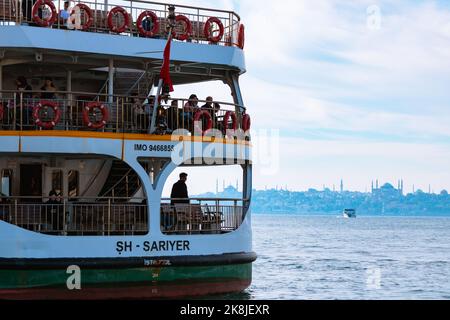 Ferry and skyline of Istanbul on the background. Famous ferries of Istanbul. Istanbul Turkey - 9.26.2022 Stock Photo