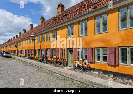 Distinctive yellow terraced houses in the Nyboder district of Copenhagen, Denmark, Europe Stock Photo