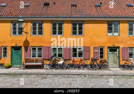 Distinctive yellow terraced houses in the Nyboder district of Copenhagen, Denmark, Europe Stock Photo
