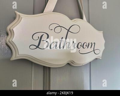 Handmade hanging wooden bathroom sign Stock Photo - Alamy