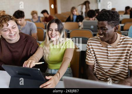 Young multiracial people studying inside university classroom - Education concept Stock Photo