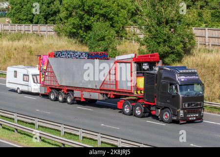 Lorry Rides Fun Fair travelling fun fair lorries trucks arrive Stock Photo - Alamy