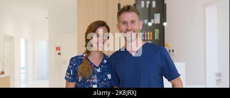 Portrait of dentist posing with nurse in dentists ambulance. Stock Photo