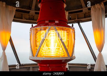 Close up of a lighthouse lamp from inside looking out windows to lake and marina in Zalivino, Kaliningrad region Stock Photo
