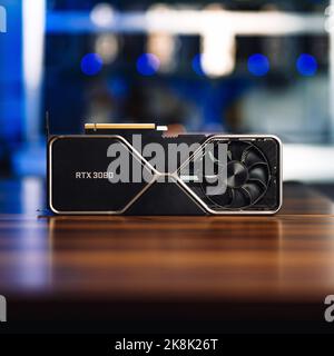A Cryptocurrency mining GPU rig computer graphics card on the table, close-up Stock Photo