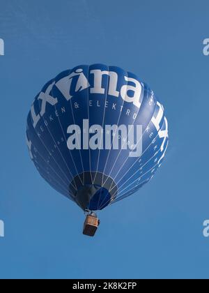 Sint Niklaas, Belgium, September 04, 2022, Blue hot air balloon high in the sky advertising kitchens and electronics Stock Photo