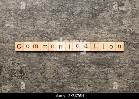 COMMUNICATION word written on wood block. COMMUNICATION text on cement table for your desing, concept. Stock Photo
