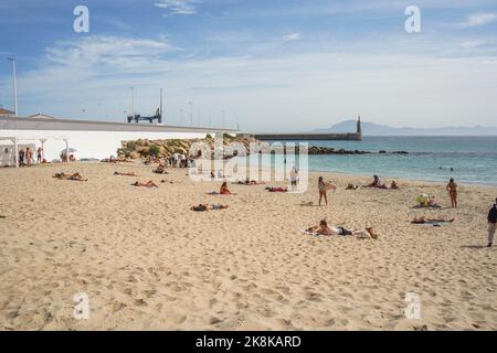 Tarifa Beach, With sunbathers at Atlantic ocean, Playa chica at Tarifa,, Andalusia, Spain Stock Photo