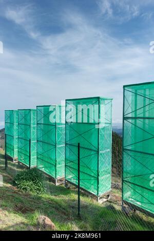 Cloud harvesting, fog catching nets, netting used to collect water from low clouds/mist/fog in mountains on Gran Canaria, Canary Islands, Spain Stock Photo