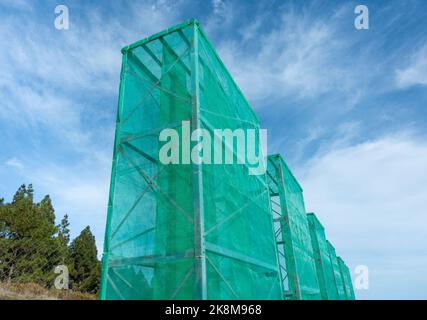 Cloud harvesting, fog catching nets, netting used to collect water from low clouds/mist/fog in mountains on Gran Canaria, Canary Islands, Spain Stock Photo