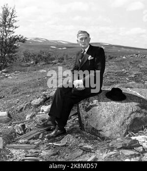 Røros 19490717 author Johan Falkberget, sitting on the cornerstone of the wheelmaker house of the mine 'Christianus Sextus'. Here Falkberget lived with his father when he started working in the mine as a year-old. The work in and around the mine formed the basis for many of his books. Photo: NTB / NTB Stock Photo