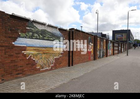 Tennents mural on exterior wall of Tennent Caledonian Breweries by Smug (Sam Bates) Glasgow Scotland July 2022 Stock Photo