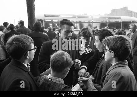 Edinburgh, Scotland - January 1965 'Kniksen' Roald Jensen has become a professional footballer in Scotland - the Hearts football club. Roald 'Kniksen' Jensen '. Here he writes autographs for some young boys. Photo: Sverre A. Børretzen / Current / NTB Stock Photo