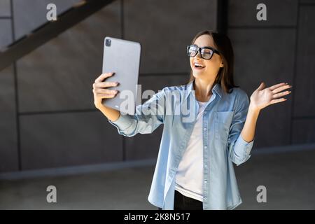 Freelance business women using tablet working call video conference with customer in workplace at home. Stock Photo