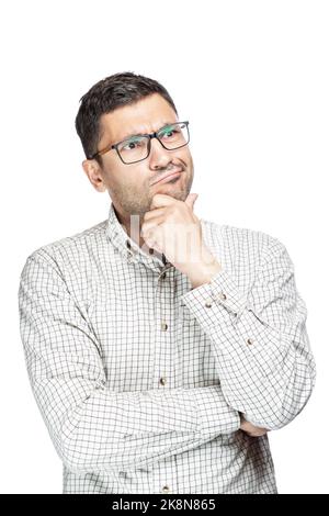 Young handsome man wearing plaid shirt over white background Thinking worried about a question, with hand on chin Stock Photo