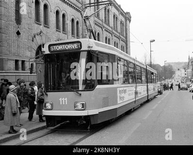 Oslo 1983-03: Last tram on Karl Johan. Restructuring of the tram routes in Oslo. The tram goes here for the last time (last day) up through Karl Johans gate in downtown Oslo, March 23, 1983. Here the tram passes, for the occasion decorated with Norwegian flags, the stop at the Storting. At the end of the street, the castle was glimpsed. Photo: Henrik Laurvik / NTB Stock Photo