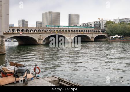 Pont de Bercy combined Road and Rail Bridge across River Seine with a train crossing, Paris, France Stock Photo