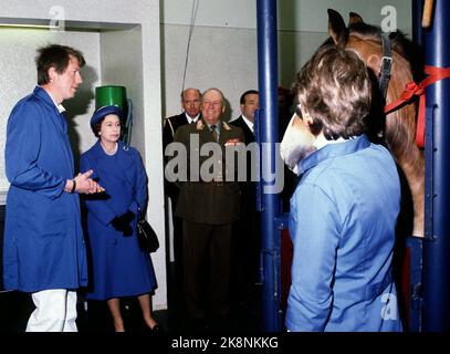 Oslo 19810507. Queen Elizabeth in Norway on a state visit with her husband Prince Philip. Queen Elizabeth and Prince Philip, following parts of an operation on a horse under a tour of Bjerke Animal Hospital. King Olav in the background. Photo: Erik Thorberg / NTB / NTB Stock Photo