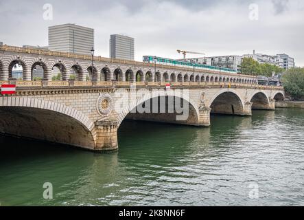 Pont de Bercy combined Road and Rail Bridge across River Seine with a train crossing, Paris, France Stock Photo