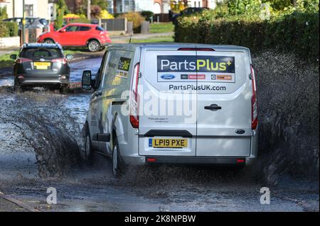 Yardley, Birmingham October 24th 2022. - Drivers negotiate their way through flooding on Yardley Green Road in the Yardley area of Birmingham on Monday afternoon. Drivers used the path on the side to drive along and avoid the deeper water however some drivers decided to plough through the middle. Pic by Credit: Stop Press Media/Alamy Live News Stock Photo