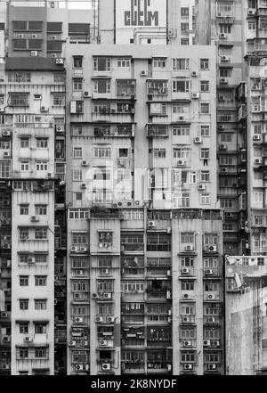 A vertical grayscale shot of high-rise buildings Stock Photo