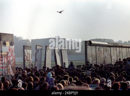 Berlin 19891112: Fall of the Berlin Wall. The wall opens in Berlin in Germany. Photo of the wall that is divided up, and a bird flying over the open wall at the new border crossing at Potsdammer Platz. Photo: Jørn H. Moen, NTB Stock Photo