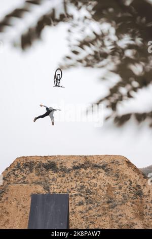 Man on bike hero flying through the air like superman fail crash Stock Photo