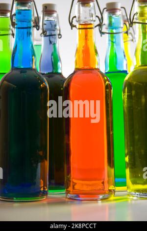 Colorful filled bottles. 3D rendering Stock Photo