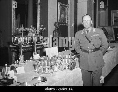 Oslo 19530702. Crown Prince Olav 50 years. Crown Prince Olav photographed at the present table at the castle. Photo: NTB Archive / NTB Stock Photo