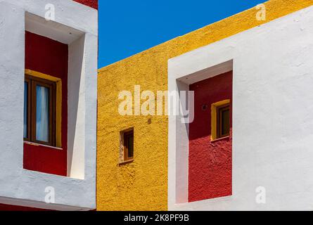 Brightly coloured holiday apartments near Rethymnon in Crete a Greek island in the Mediterranean sea. Stock Photo