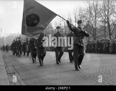 WW2 Oslo 19411025. In Norway from 1941, the Labor Service was made compulsory for men of conscripts. Here, the Defilation of the Labor Service at the University Square October 25, 1941. The tab leads the parade. ***** Mandatory Employment Service for Norwegian Conscript Men. Military Parade October 25, 1941. Photo: Aage Kihle / NTB Stock Photo