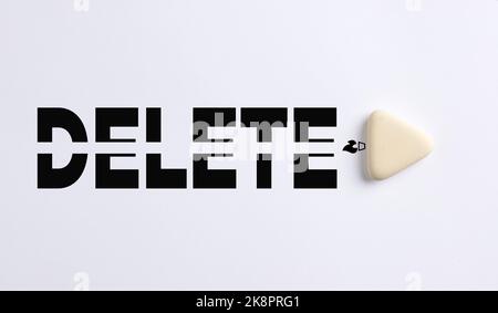 To clear the past, delete problems and correct mistakes in business or education concept. White eraser erases the word delete on white background. Stock Photo