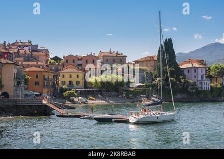 Varenna Lake Como, view in summer of boats moored in the harbor of the scenic lakeside town of Varenna, Lombardy, Italy Stock Photo