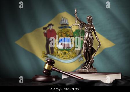 Delaware US state flag with statue of lady justice, constitution and judge hammer on black drapery. Concept of judgement and punishment Stock Photo