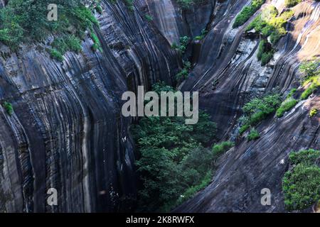 An aerial view of scenic rocky Gaoyi Ridge with scattered green ...