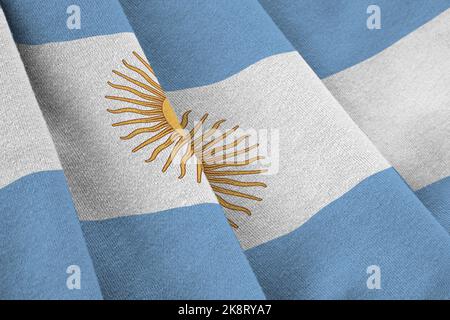 Argentina flag with big folds waving close up under the studio light indoors. The official symbols and colors in fabric banner Stock Photo