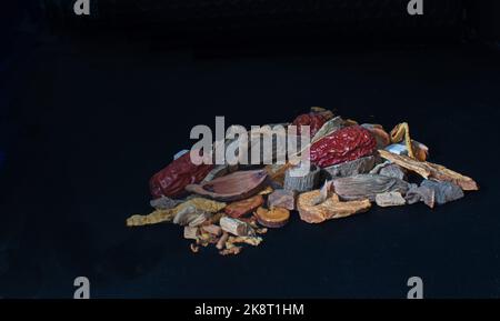 Still Life of a selection of chinese herbs on black background Stock Photo