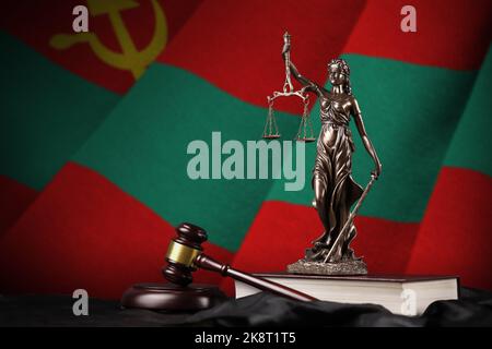 Transnistria flag with statue of lady justice, constitution and judge hammer on black drapery. Concept of judgement and punishment Stock Photo