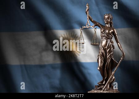 Argentina flag with statue of lady justice and judicial scales in dark room. Concept of judgement and punishment, background for jury topics Stock Photo