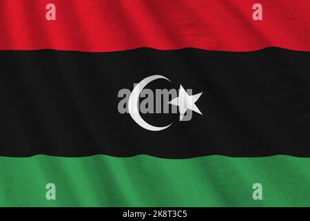 Libya flag with big folds waving close up under the studio light ...