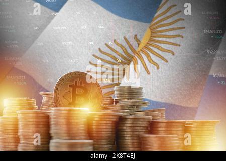Argentina flag and big amount of golden bitcoin coins and trading platform chart. Crypto currency concept Stock Photo