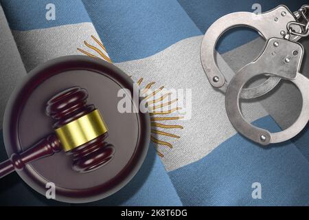 Argentina flag with judge mallet and handcuffs in dark room. Concept of criminal and punishment, background for guilty topics Stock Photo