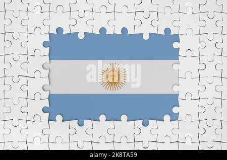Argentina flag in frame of white puzzle pieces with missing central parts Stock Photo