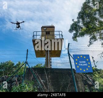 Finland Russia border fence with drone concept image. Stock Photo